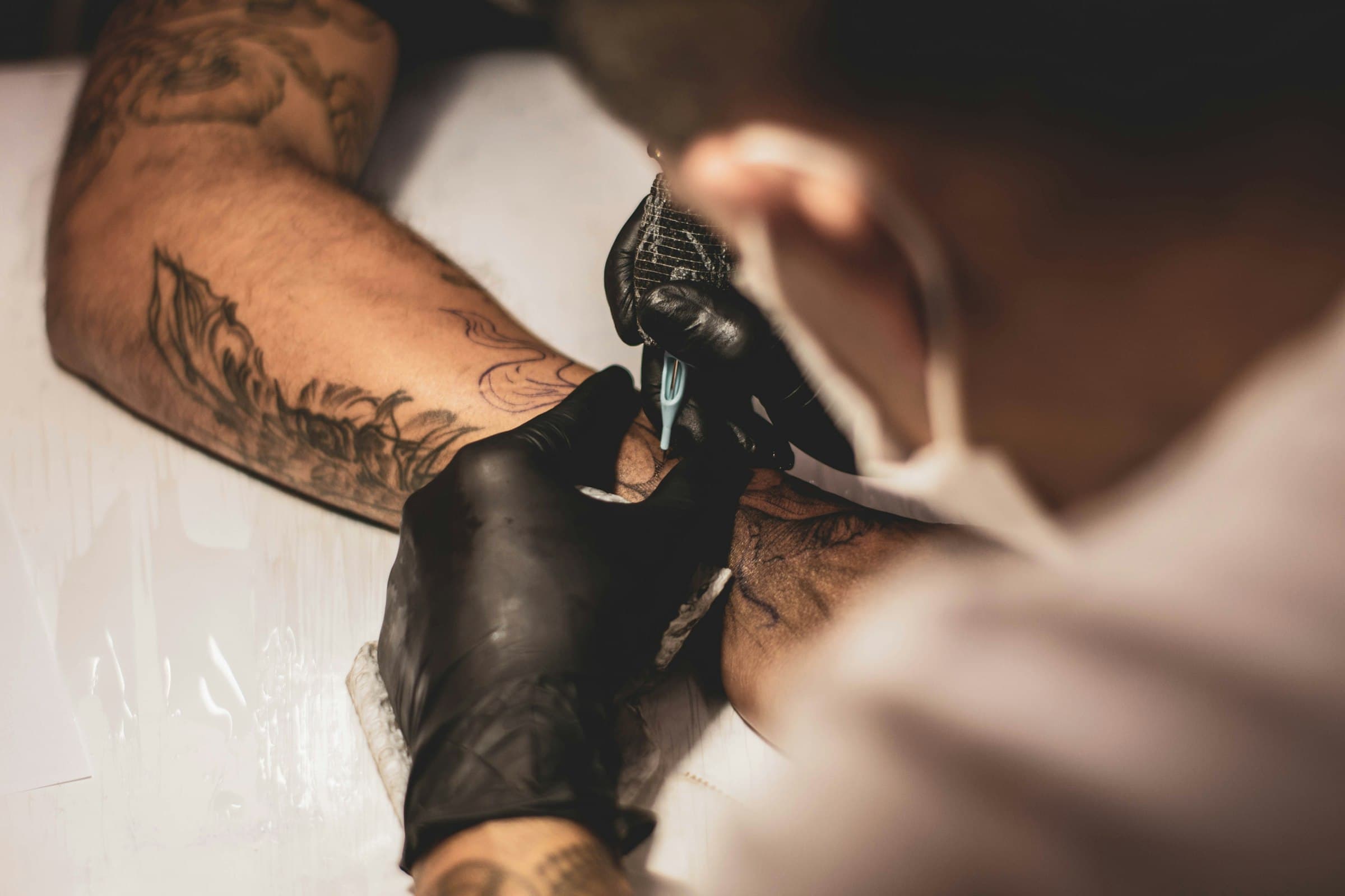 Artist preparing a custom tattoo